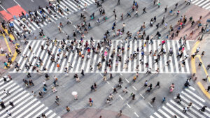 Ariel view of busy Tokyo intersection with people moving in all directions