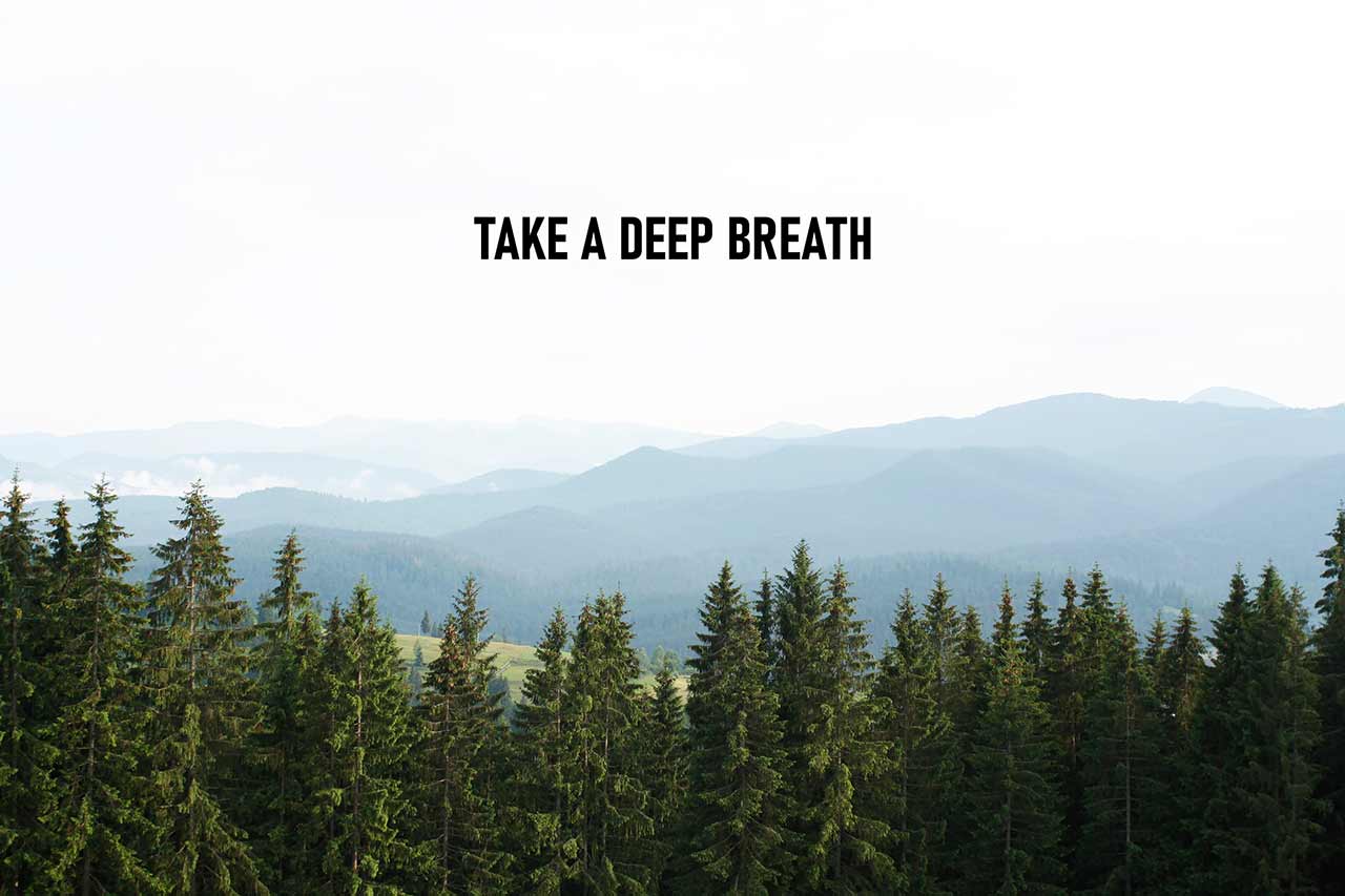 Take a Deep Breath is shown using the text and photo of misty mountains